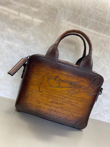 andonaimi mini cowhide hand-polished color custom-made fashion all-match briefcase with shoulder strap1
andonaimi mini cowhide hand-polished color custom-made fashion all-match briefcase with shoulder strap1