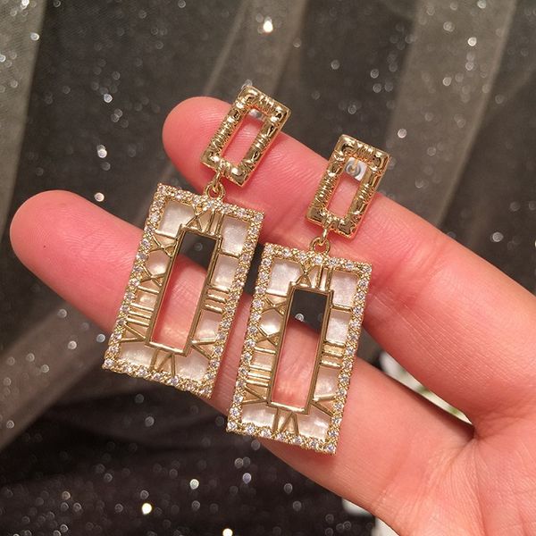 sparkling zirconia diamond roman numerals hollow shell earrings fashion luxury designer pendant stud earrings for woman girls s925 post, Golden;silver
sparkling zirconia diamond roman numerals hollow shell earrings fashion luxury designer pendant stud earrings for woman girls s925 post, Golden;silver