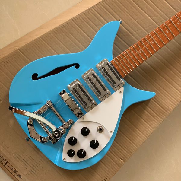 three pickup 325 electric guitar,the fingerboard has varnish on it, half-hollow light blue body has a f hole in i
three pickup 325 electric guitar,the fingerboard has varnish on it, half-hollow light blue body has a f hole in i