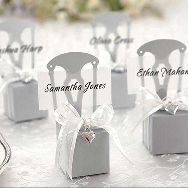 100pcs lot wedding favors candy boxes chair shape place card holder paper gift boxes with name card ribbon heart pendant1
100pcs lot wedding favors candy boxes chair shape place card holder paper gift boxes with name card ribbon heart pendant1