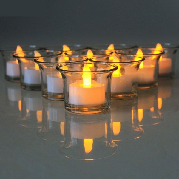a pack of 12 flashing flameless and waterproof candle lights floating on a plastic battery-operated swimming pool spa tea light with water
a pack of 12 flashing flameless and waterproof candle lights floating on a plastic battery-operated swimming pool spa tea light with water