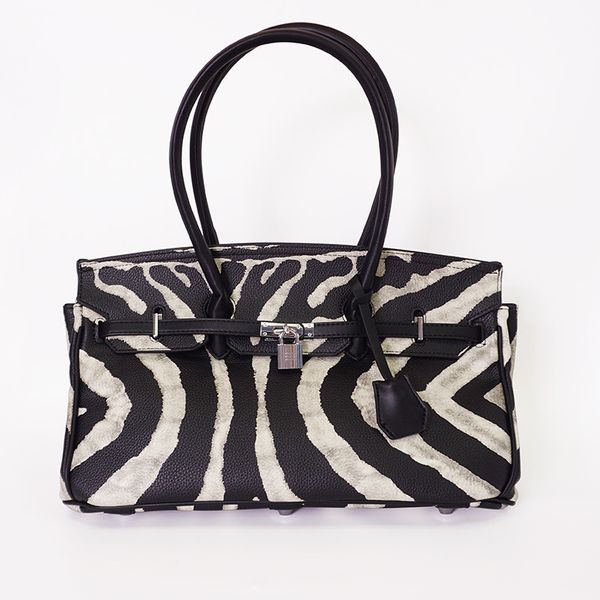 new retro black and white distressed bag portable shoulder bag kelly bag birkin female wholesale milk large zebra pattern
new retro black and white distressed bag portable shoulder bag kelly bag birkin female wholesale milk large zebra pattern