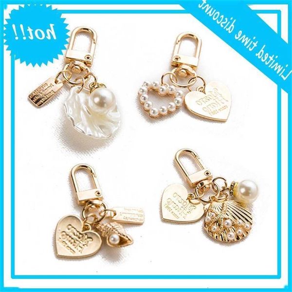 4.pieces lovely love letter shell conch pearl metal golden kit girls'tas charm car keychain fashion jewelry, Black
4.pieces lovely love letter shell conch pearl metal golden kit girls'tas charm car keychain fashion jewelry, Black