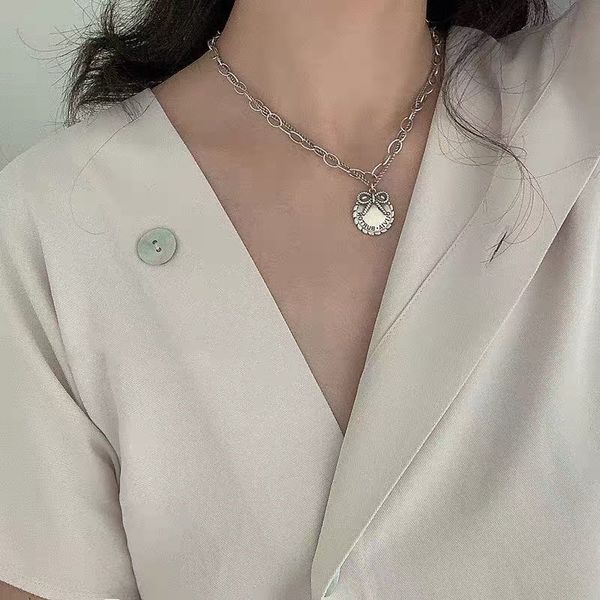 titanium steel old cute big bow, exquisite temperament letter card round wind temperament double, Silver
titanium steel old cute big bow, exquisite temperament letter card round wind temperament double, Silver