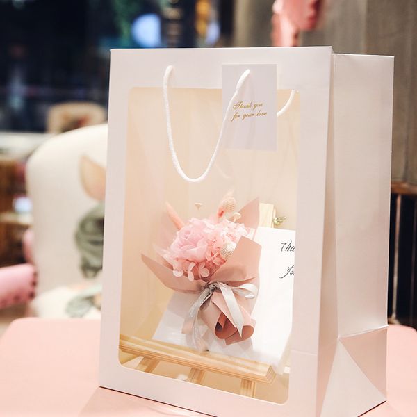 transparent flower portable gift bag creative transparent window handbag birthday gift flower bag immortal flower stand hand carry gift bag
transparent flower portable gift bag creative transparent window handbag birthday gift flower bag immortal flower stand hand carry gift bag