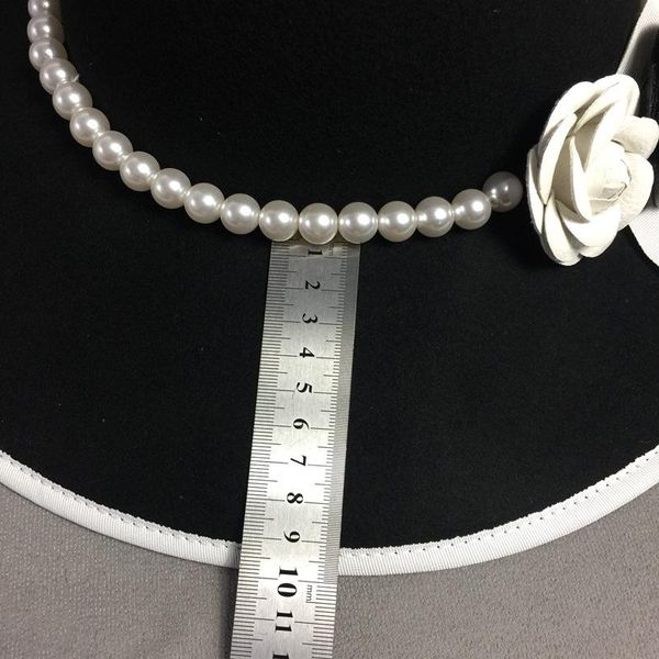 2020 formal wide brim white black flower fedora hat pearls band 100% wool felt floppy ladies wedding church hat porkpie trilby hat, Black;white
2020 formal wide brim white black flower fedora hat pearls band 100% wool felt floppy ladies wedding church hat porkpie trilby hat, Black;white