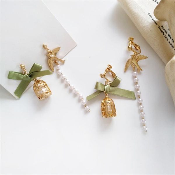 ruanme asymmetry of a pair of bow earring han edition women pearl earrings small cage no ear pierced ear clip long pearl earring, Golden;silver 
ruanme asymmetry of a pair of bow earring han edition women pearl earrings small cage no ear pierced ear clip long pearl earring, Golden;silver