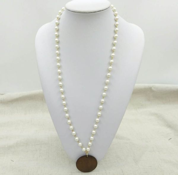 foreign trade personality long pearl chain wooden plate pendant handmade fashion autumn and winter sweater accessories, Silver
foreign trade personality long pearl chain wooden plate pendant handmade fashion autumn and winter sweater accessories, Silver