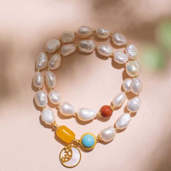 natural baroque shaped pearl double-layer bracelet with honey wax south red shell moon and clavicle chain, Black
natural baroque shaped pearl double-layer bracelet with honey wax south red shell moon and clavicle chain, Black