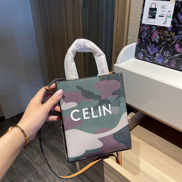 2021 new trend c home camouflage canvas vertical mini tote shopping bag trend women's bag age reducing women's bag designers bags
2021 new trend c home camouflage canvas vertical mini tote shopping bag trend women's bag age reducing women's bag designers bags