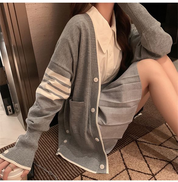 2020 early autumn new loose leisure four bar stripe medium long white v-neck tb knitted cardigan jacket women
2020 early autumn new loose leisure four bar stripe medium long white v-neck tb knitted cardigan jacket women