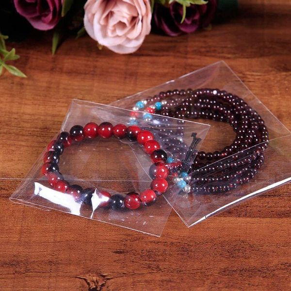 gift wrap transparent self sealing plastic bags jewelry packaging bag adhesive resealable cellophane poly opp baggie 
gift wrap transparent self sealing plastic bags jewelry packaging bag adhesive resealable cellophane poly opp baggie