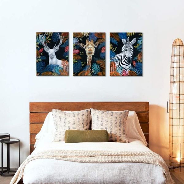 paintings wild animals zebras, deer and giraffes decorate the walls with 3 canvas art pictures in a palm leaf background
paintings wild animals zebras, deer and giraffes decorate the walls with 3 canvas art pictures in a palm leaf background