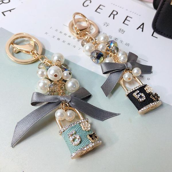 other korean pearl keychain bag plush car key ring camellia flower hat tassel style chain, Golden;white
other korean pearl keychain bag plush car key ring camellia flower hat tassel style chain, Golden;white