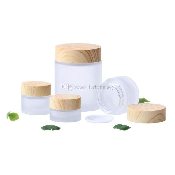 frosted glass jar cream bottles round cosmetic jars hand face cream bottle with wood grain cap 5g-10g-15g-30g-50g-100g
frosted glass jar cream bottles round cosmetic jars hand face cream bottle with wood grain cap 5g-10g-15g-30g-50g-100g
