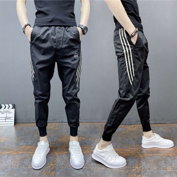 2020 new men's small foot casual three bar sports thin capris trend black slim harem pants
2020 new men's small foot casual three bar sports thin capris trend black slim harem pants