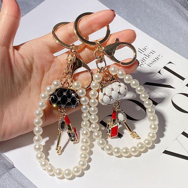 keychains simple retro pearl chain bag key fashion inlaid rhinestones car keyring female pendant metal charm jewelry accessories, Silver
keychains simple retro pearl chain bag key fashion inlaid rhinestones car keyring female pendant metal charm jewelry accessories, Silver