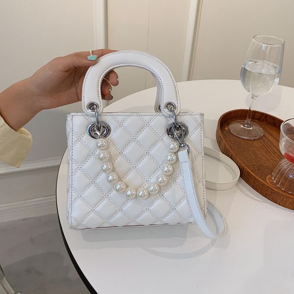 2021 summer trend new korean fashion versatile princess of wales bag ling lattice embroidered thread single shoulder oblique span pearl
2021 summer trend new korean fashion versatile princess of wales bag ling lattice embroidered thread single shoulder oblique span pearl