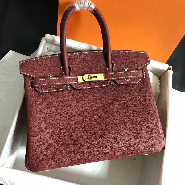 wholesale half handmade quality togo leather desingers handbag30cm wax line stitching burgundy colors gold silver hardware by order only
wholesale half handmade quality togo leather desingers handbag30cm wax line stitching burgundy colors gold silver hardware by order only