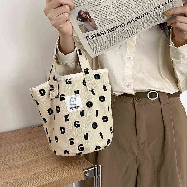 shopping bags hylhexyr female full letter printed canvas bag small bucket shaped simple bento casual handbag and purses 220307
shopping bags hylhexyr female full letter printed canvas bag small bucket shaped simple bento casual handbag and purses 220307