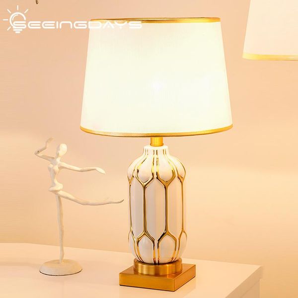 luxury modern white ceramic table lamp for bedroom bedside lamp nordic simple american led desk e27 110v 220v home decor
luxury modern white ceramic table lamp for bedroom bedside lamp nordic simple american led desk e27 110v 220v home decor