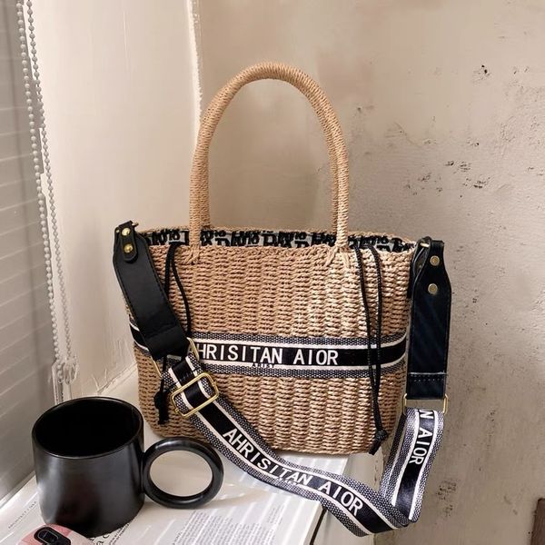 2021 new grass woven tote capacity letter embroidered vegetable basket wide shoulder strap portable messenger bag
2021 new grass woven tote capacity letter embroidered vegetable basket wide shoulder strap portable messenger bag