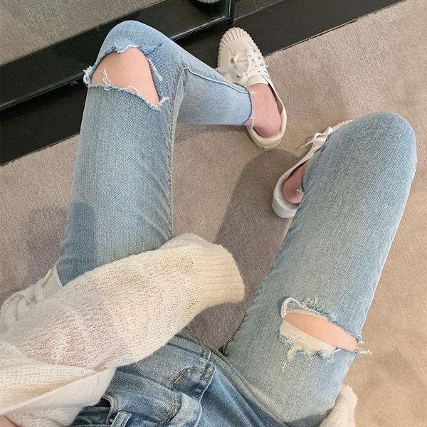 woman jeans pants ripped autumn light blue high waist stretch skinny tappered pants
woman jeans pants ripped autumn light blue high waist stretch skinny tappered pants