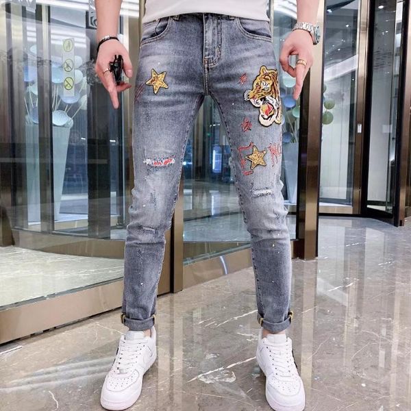 men's jeans european style tiger embroidered light blue washed hole pants vintage patch
men's jeans european style tiger embroidered light blue washed hole pants vintage patch
