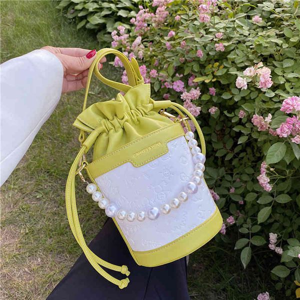 handbag korean texture bag female 2021 summer pearl portable bucket net red embossed single shoulder messenger tide
handbag korean texture bag female 2021 summer pearl portable bucket net red embossed single shoulder messenger tide