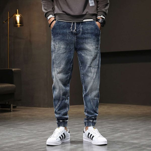 autumn and winter new jeans men's wide harem trend stitching elastic waist binding small leg long pantsw, Blue 
autumn and winter new jeans men's wide harem trend stitching elastic waist binding small leg long pantsw, Blue