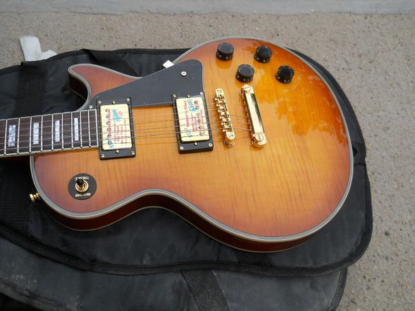 flyoung lp custom electric guitar front tiger patch sunset transparent red rosewood
flyoung lp custom electric guitar front tiger patch sunset transparent red rosewood