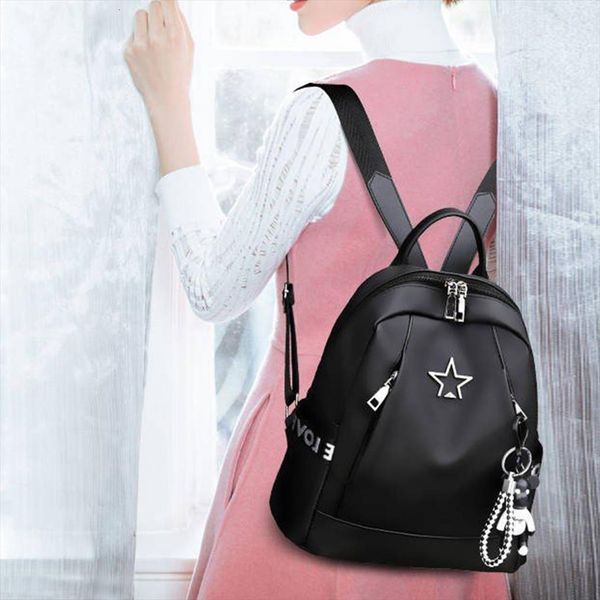 large capacity shoulder bag women oxford waterproof backpack black color school bags casual travel with bear pendant
large capacity shoulder bag women oxford waterproof backpack black color school bags casual travel with bear pendant