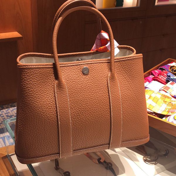 new leather women's bag togo garden tot portable large capacity shopping bag wedding outlets
new leather women's bag togo garden tot portable large capacity shopping bag wedding outlets