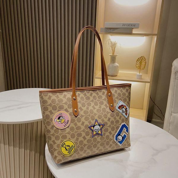 autumn and winter new fashion versatile single shoulder printed badge large bag tote kou home shopping bag
autumn and winter new fashion versatile single shoulder printed badge large bag tote kou home shopping bag