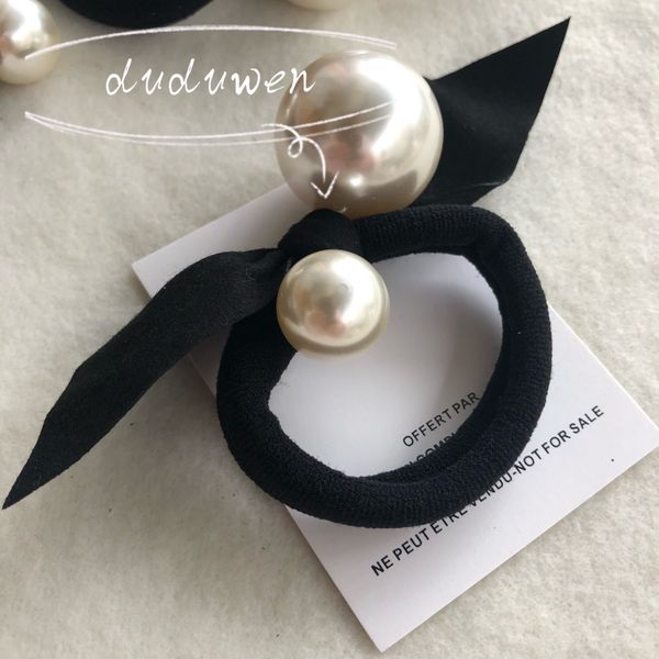 pearls and bow hairtie fashion c elastic hand party gift fashion hair tie 
pearls and bow hairtie fashion c elastic hand party gift fashion hair tie