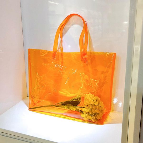 storage bags large capacity clear tote bag, orange pvc shoulder handbag for women, stadium bag shopping, sports and work
storage bags large capacity clear tote bag, orange pvc shoulder handbag for women, stadium bag shopping, sports and work