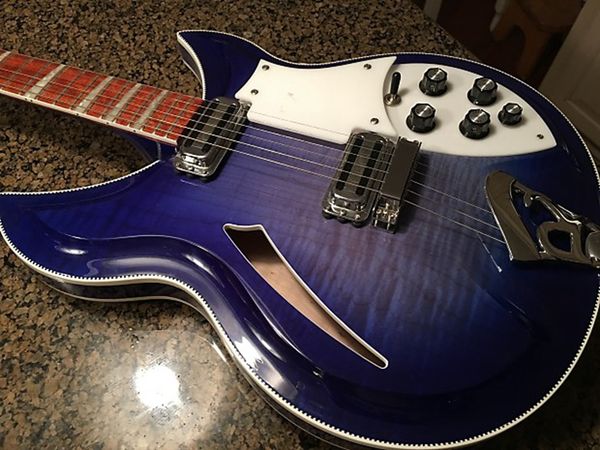 12 strings 381 flame maple 1989 semi hollow body blue electric guitar lacquer paint fingerboard, checkerboard binding, sandwich neck
12 strings 381 flame maple 1989 semi hollow body blue electric guitar lacquer paint fingerboard, checkerboard binding, sandwich neck
