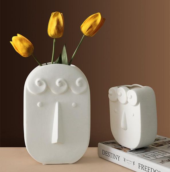 face vase ceramic decoration living room flower arrangement art decoration dry flower nordic home vases 
face vase ceramic decoration living room flower arrangement art decoration dry flower nordic home vases