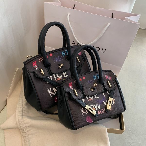 graffiti second generation kelly female mini large capacity white fashion versatile spoof portable messenger bag
graffiti second generation kelly female mini large capacity white fashion versatile spoof portable messenger bag