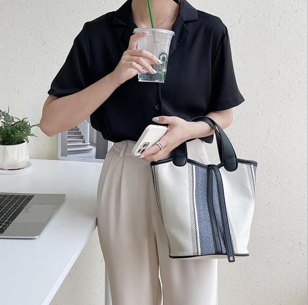 summer bags female fashion personality handbag trend stitching shoulder messenger canvas printing bucket bag
summer bags female fashion personality handbag trend stitching shoulder messenger canvas printing bucket bag