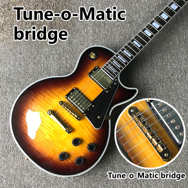electric guitar, rosewood fingerboard, flame maple tune-o-matic bridge, 
electric guitar, rosewood fingerboard, flame maple tune-o-matic bridge,