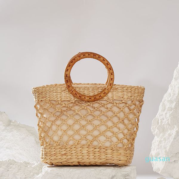 natural environmental protection straw woven hollow bag large capacity retro wooden handle handbag
natural environmental protection straw woven hollow bag large capacity retro wooden handle handbag