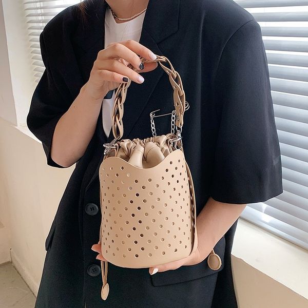 female messenger single shoulder bag 2021 new trend drawstring hollow out street portable personalized bucket bag
female messenger single shoulder bag 2021 new trend drawstring hollow out street portable personalized bucket bag