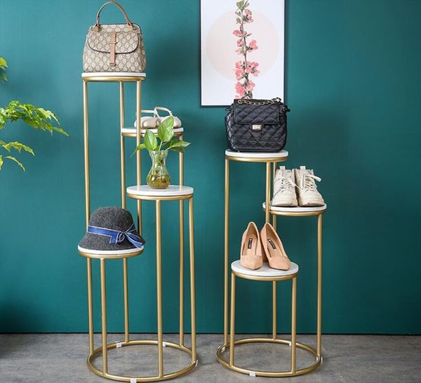 simple and creative iron marble multi layer shelf clothing store floor display shelf bag shoes display rack
simple and creative iron marble multi layer shelf clothing store floor display shelf bag shoes display rack