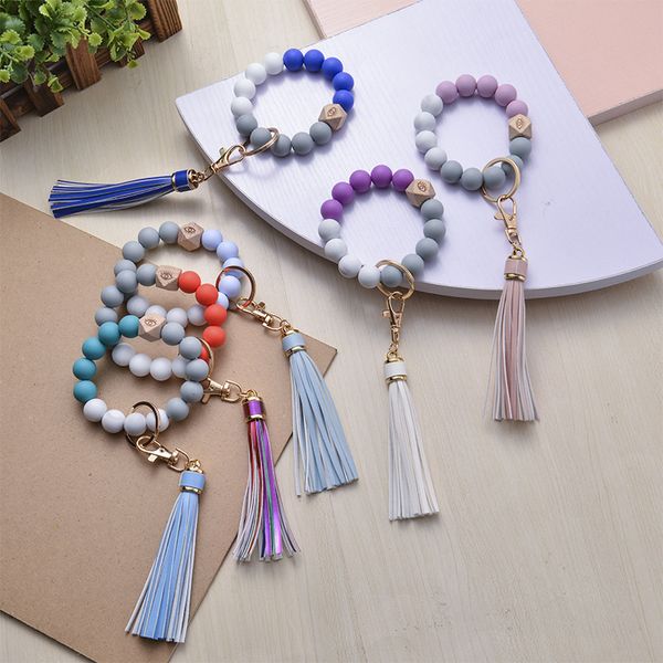 factory wholesale silicone keychain wooden bead bracelet keyring pendant 18 colors party gift
factory wholesale silicone keychain wooden bead bracelet keyring pendant 18 colors party gift