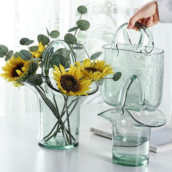vases nordic creative portable glass vase home living room hydroponic flower arrangement table decoration bag model ornaments
vases nordic creative portable glass vase home living room hydroponic flower arrangement table decoration bag model ornaments