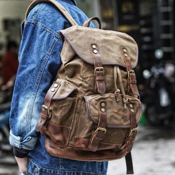 backpack retro distressed wax canvas with cowhide notebook bag men and women commuting outdoor mountaineering 
backpack retro distressed wax canvas with cowhide notebook bag men and women commuting outdoor mountaineering