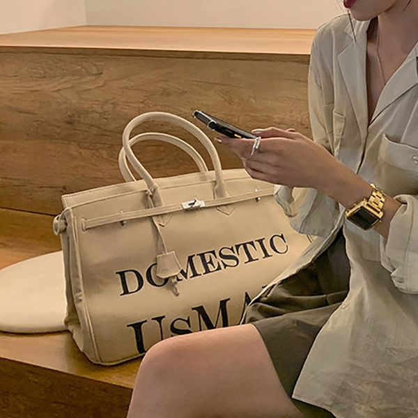 beggars' letter white army cloth canvas kelly large capacity one shoulder hand carry underarm bag girl
beggars' letter white army cloth canvas kelly large capacity one shoulder hand carry underarm bag girl