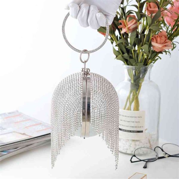 new glittering full diamond tassel ball ring handbag banquet straddle small nightclub dress bag
new glittering full diamond tassel ball ring handbag banquet straddle small nightclub dress bag