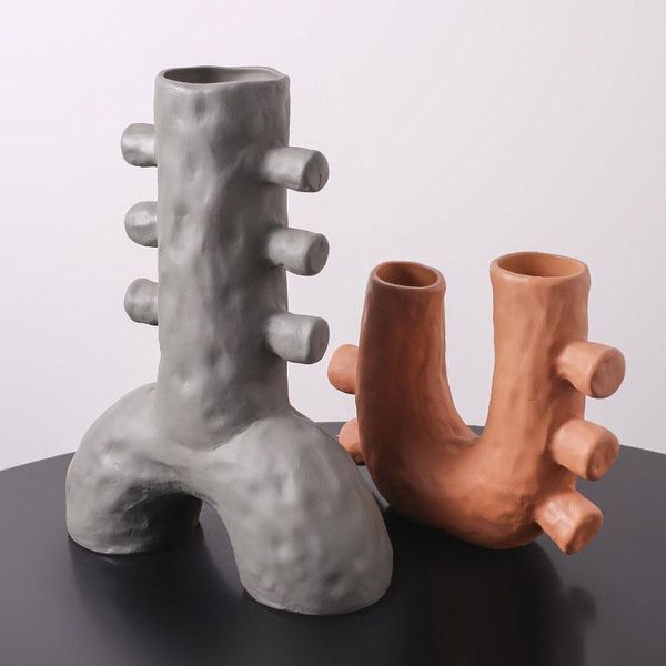 vases nordic creative irregular u-shaped art vase ceramic flower hydroponic device deskeuropean home decoration accessories
vases nordic creative irregular u-shaped art vase ceramic flower hydroponic device deskeuropean home decoration accessories